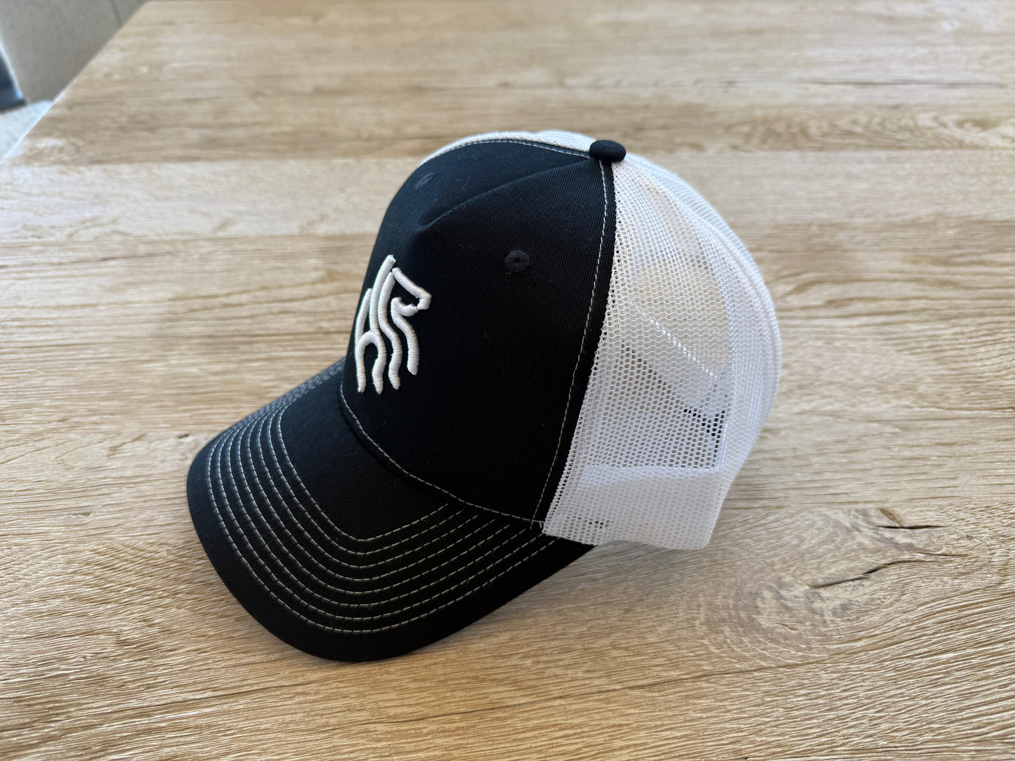American Reins Puff Embroidery Trucker Hat - Black + White