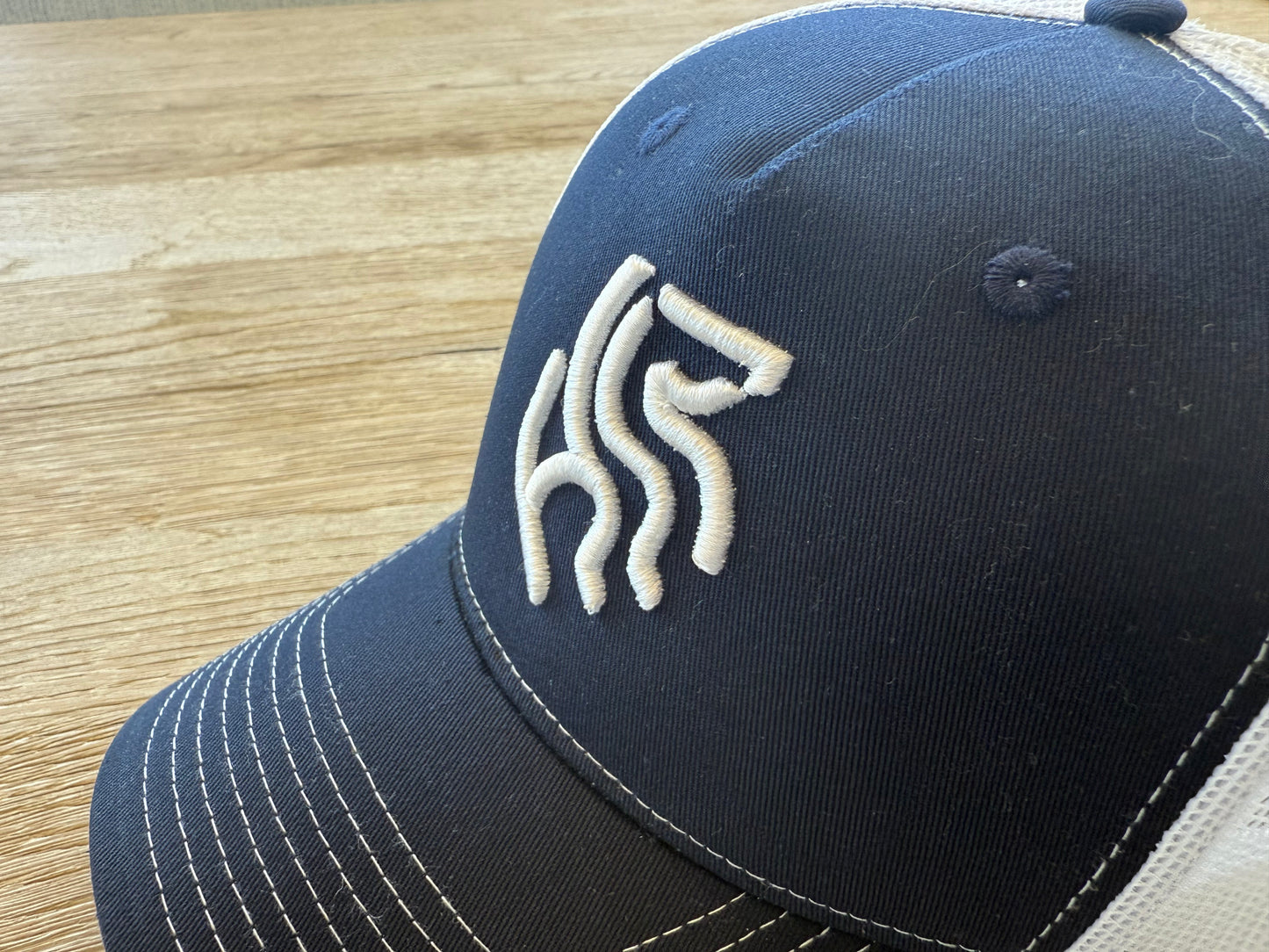 American Reins Puff Embroidery Trucker Hat - Navy + White