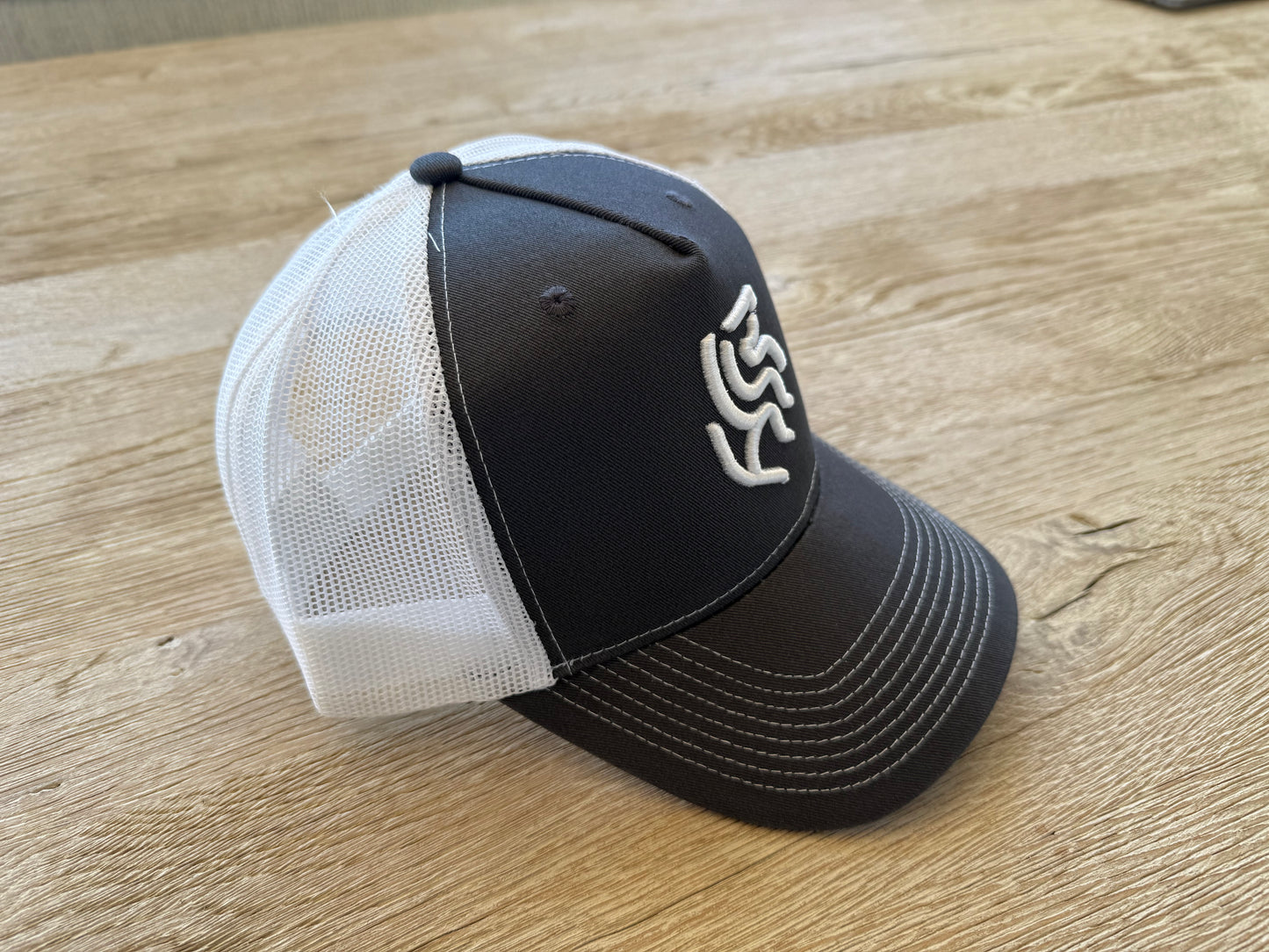 American Reins Puff Embroidery Trucker Hat - Charcoal + White